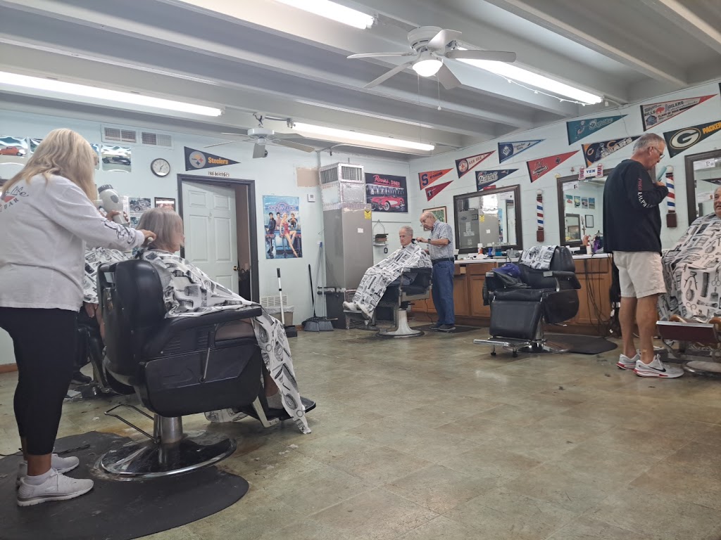 Inside Bobby's Barber Shop — a classic small barbershop interior with barber chair and tools